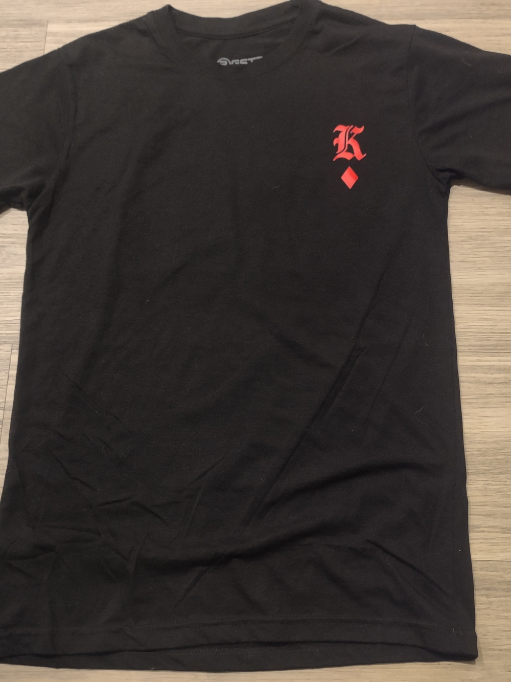 Black Graphic Tee with Red Crest Detail